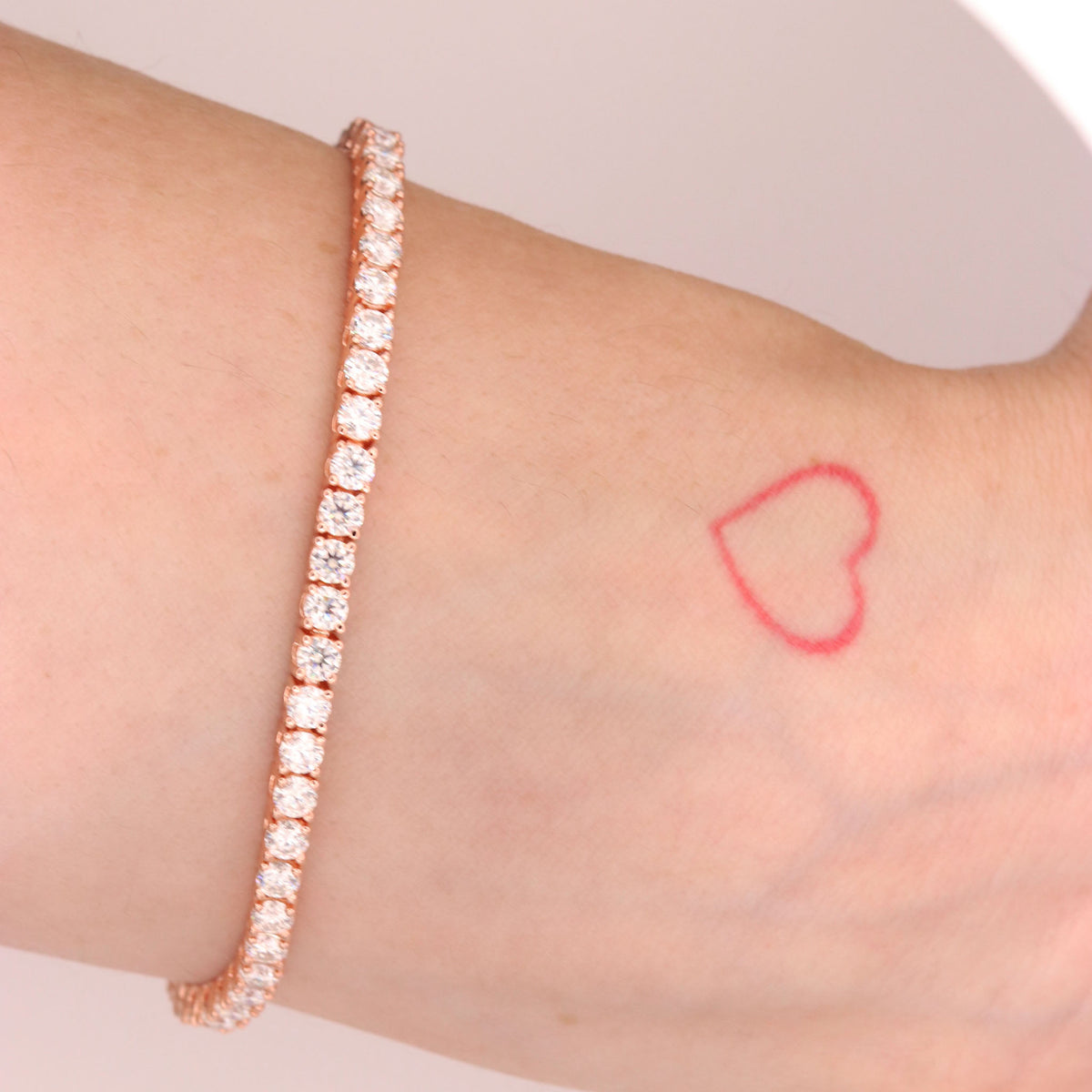 Rose gold moissanite on wrist